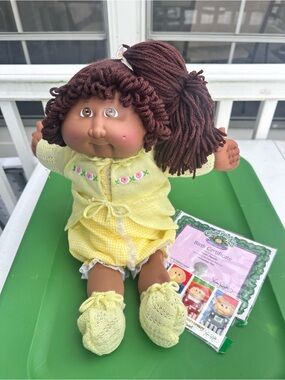 Brown-Haired Girl Doll in Yellow Outfit